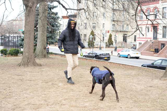 Man playing with dog