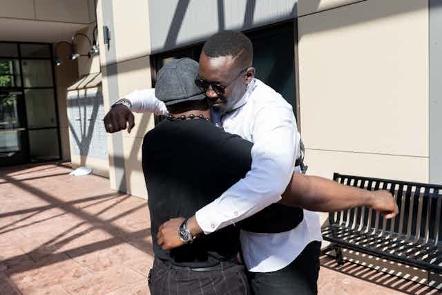 Black men hugging