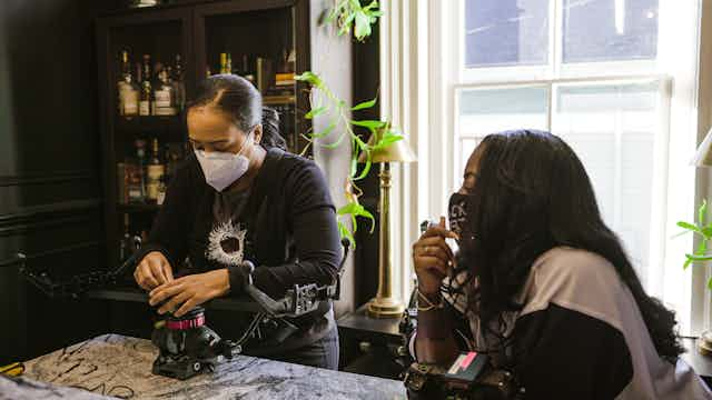 Woman setting up camera slider